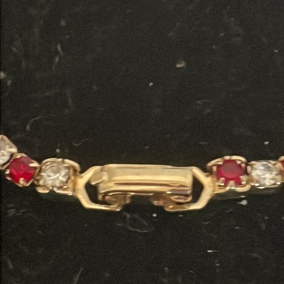 7.5” gold plated tennis bracelet with 38 prong set red and clear crystals - Picture 7 of 15